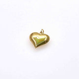 Chunky heart charm in gold finish against white background.